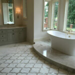 A large bathroom with a tub and sink in it